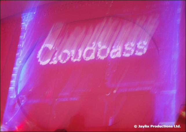 The word Cloudbass projected in white on a pink and purple background