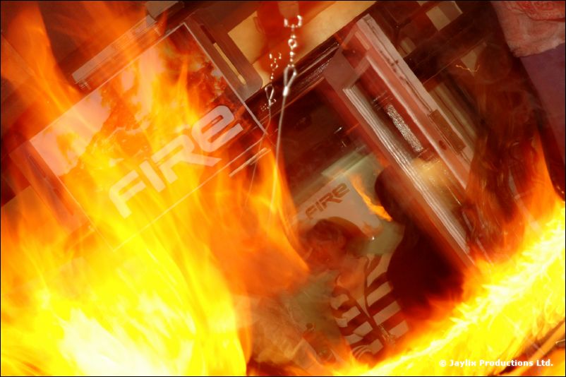 A collage of flames layered over a FIRE flyer