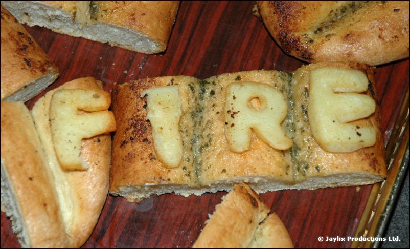 Garlic bread with the letters F, I, R and E formed from dough