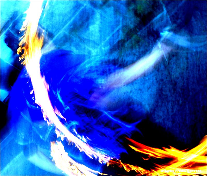 Abstract blur of blue light with a curved streak of fire