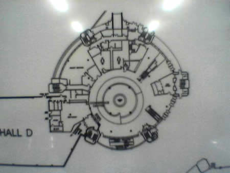 A line drawing floor plan of a circular exhibition hall, labelled Hall D