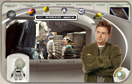 Screenshot of a Hitchhiker's Guide to the Galaxy film website with a man in a green jumper and a small robot