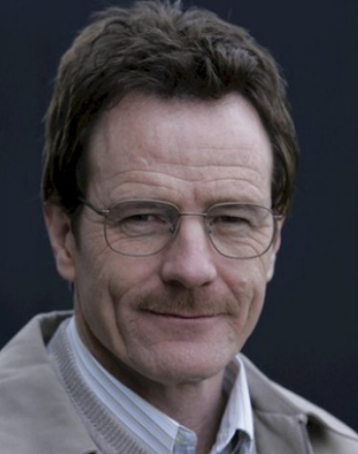 Close-up portrait of a middle-aged man with glasses and a moustache, wearing a beige jacket
