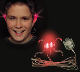 A smiling young person wears red light-up earpieces, with the earpiece device shown below